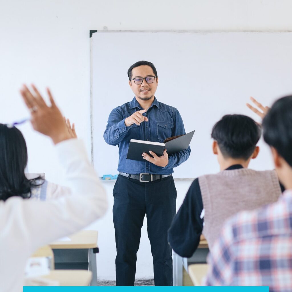 Lecturer teaching to students in a classroom